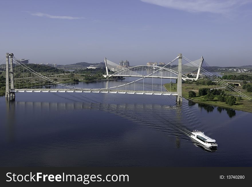 Scenic view of lake cruise by boat at two bridges in Putrajaya, Malaysia