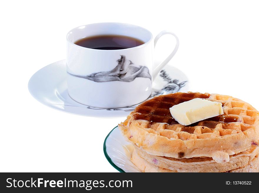 Easy dessert - wafers with oil and a syrup, on a background a cup with tea.