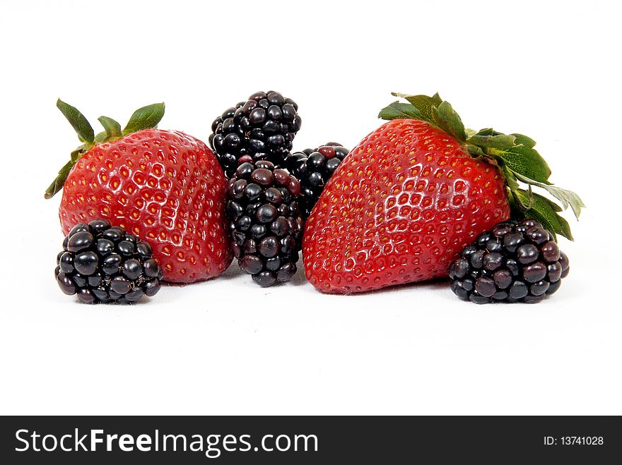 Strawberries And Blackberries On White Background