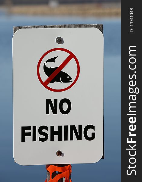 A no fishing allowed sign shows a fish with a circle through it.