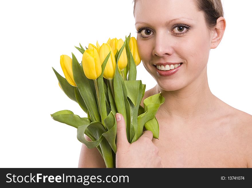 Young woman with yellowtulips