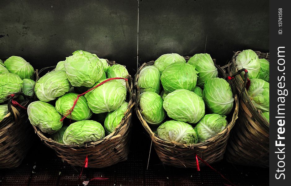 Cabbages in baskets at a Hong Kong indoor market, Wanchai.