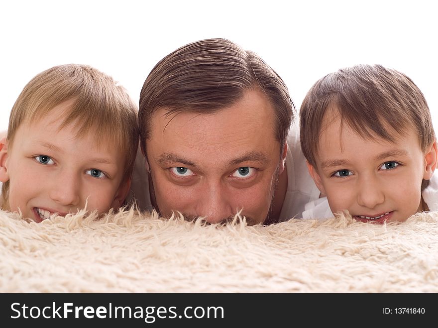 Young family three lying on the bed