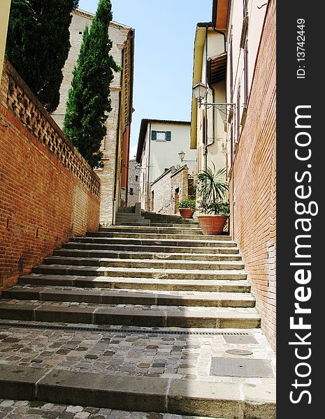 A narrow staircasein an Italian city. A narrow staircasein an Italian city