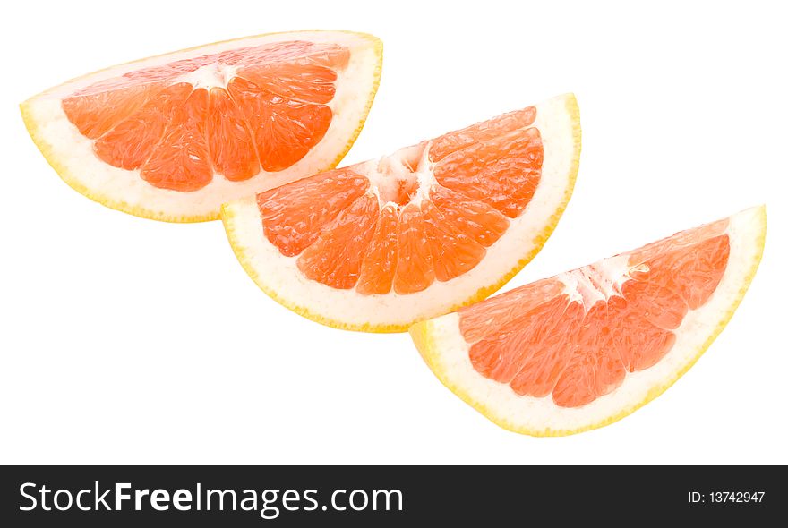 Close-up grapefruit peaces, isolated on white