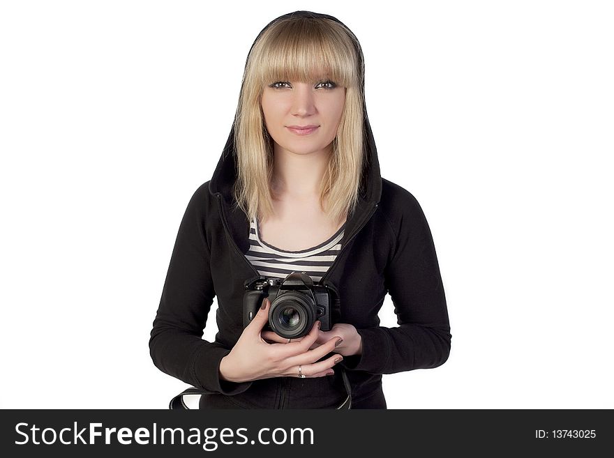 Woman holding camera and looking straight. Woman holding camera and looking straight