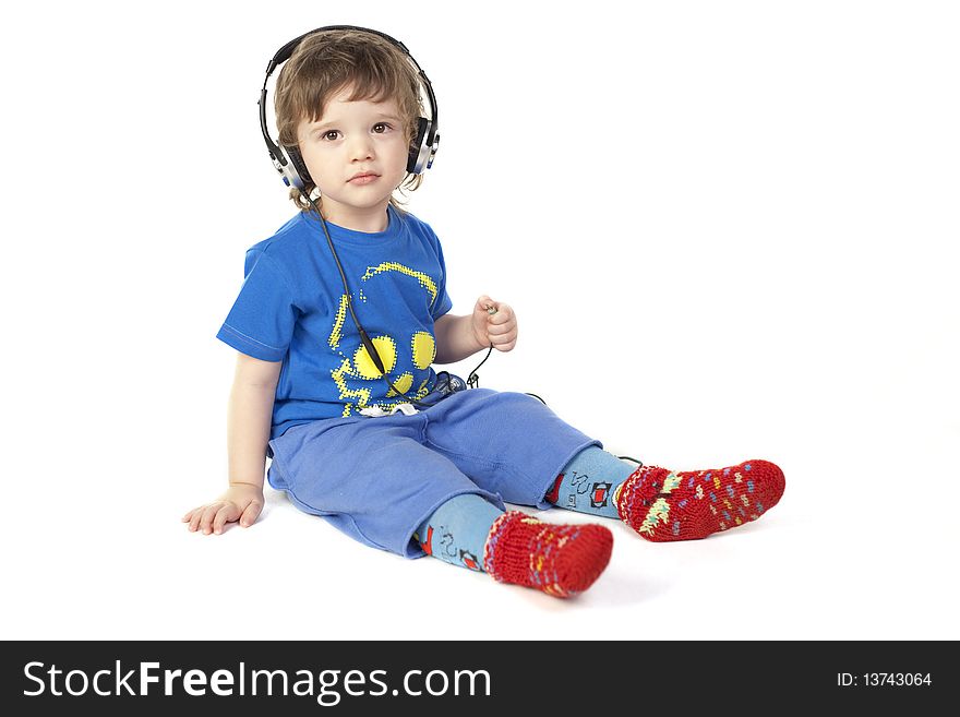 Cute child with headphones on a white background. Cute child with headphones on a white background