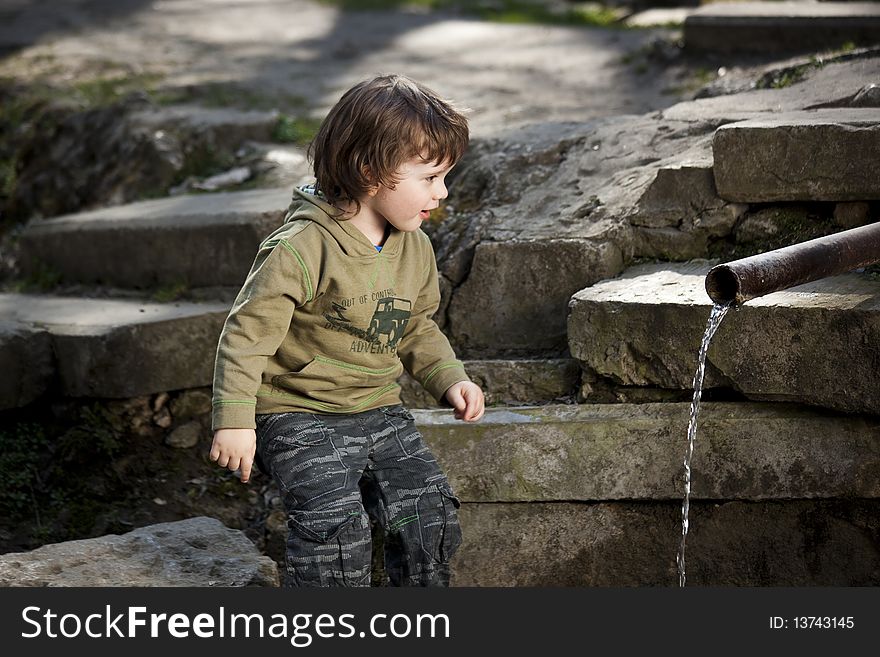 Cute surprised child in a nice landscape. Cute surprised child in a nice landscape