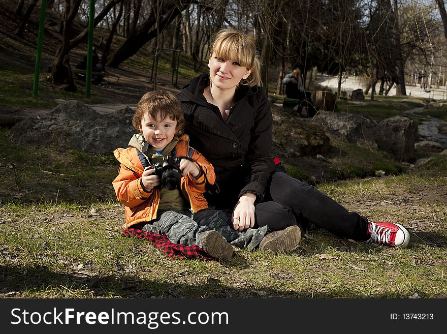 Woman and her son posing at camera. Woman and her son posing at camera