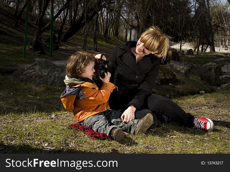 Cute child taking pictures of his mother. Cute child taking pictures of his mother