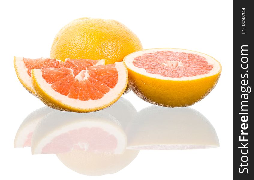 Close-up red grapefruits with reflection, isolated on white
