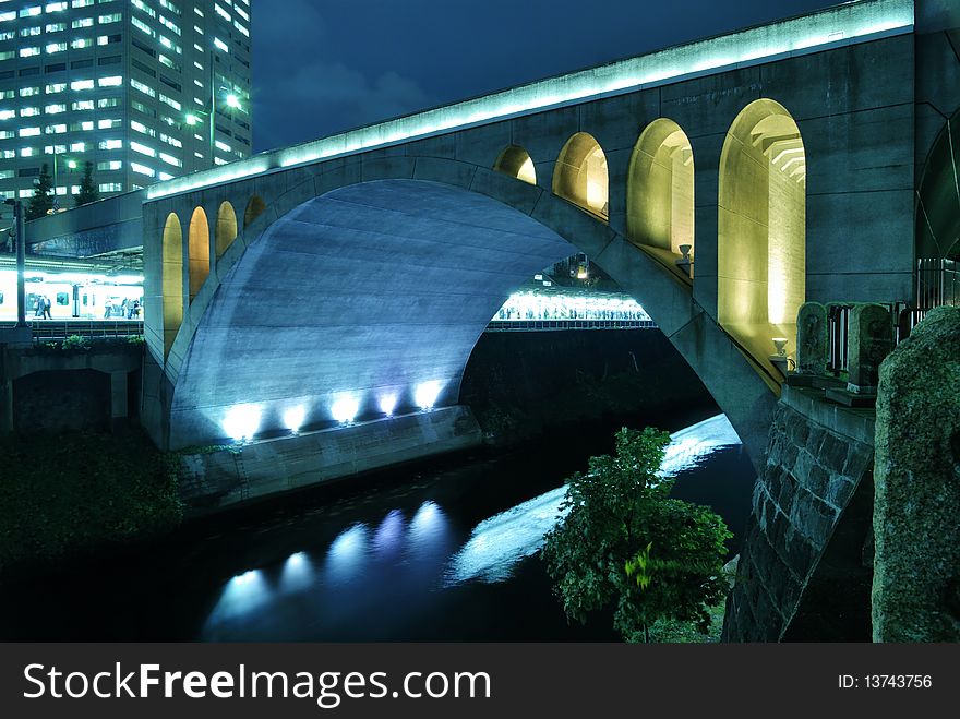 Scenic night view to the famous Hijiribashi Bridge and Ochanomizu station behind it in Tokyo, Japan