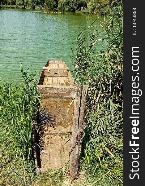 Abandoned rowing boat on a lake. Abandoned rowing boat on a lake.