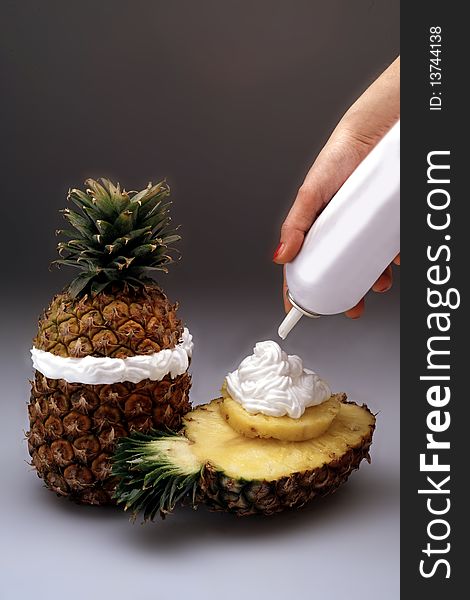 Pineapple with decoration of whipped cream. Pineapple with decoration of whipped cream