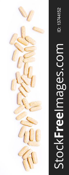 Macro Of Beige Pills Isolated On White Background
