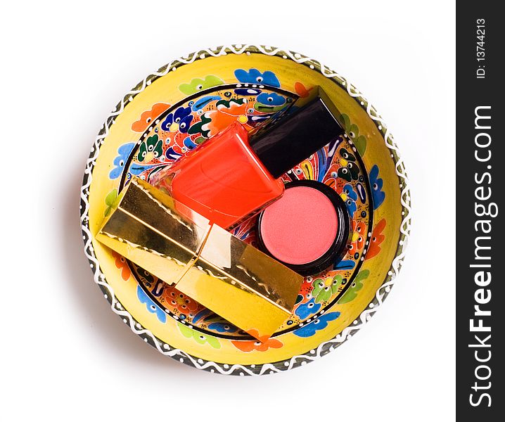 Group of cosmetics in colorful plate isolated on a white background. Group of cosmetics in colorful plate isolated on a white background