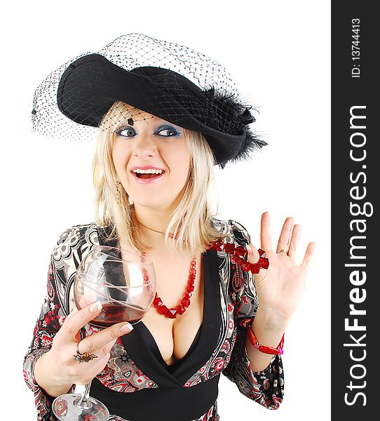 Beautiful blond woman in fashion dress and old stile hat with glass of wine isolated on the white. Studio shoot for actress in retro stile. Beautiful blond woman in fashion dress and old stile hat with glass of wine isolated on the white. Studio shoot for actress in retro stile.