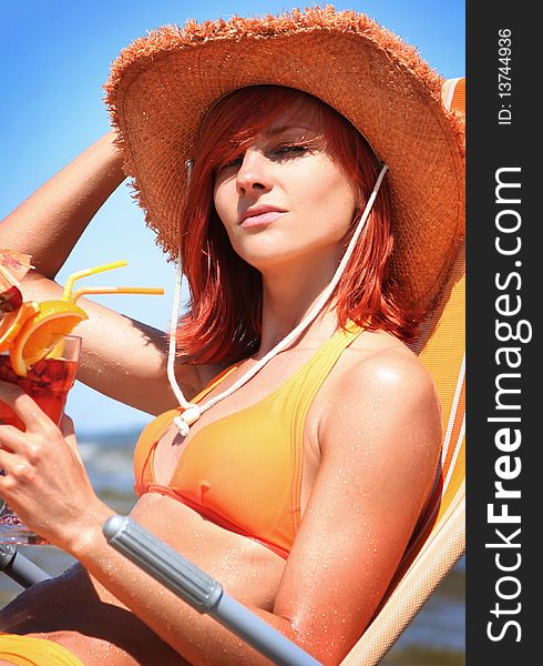 Young woman relaxing on beach. Young woman relaxing on beach