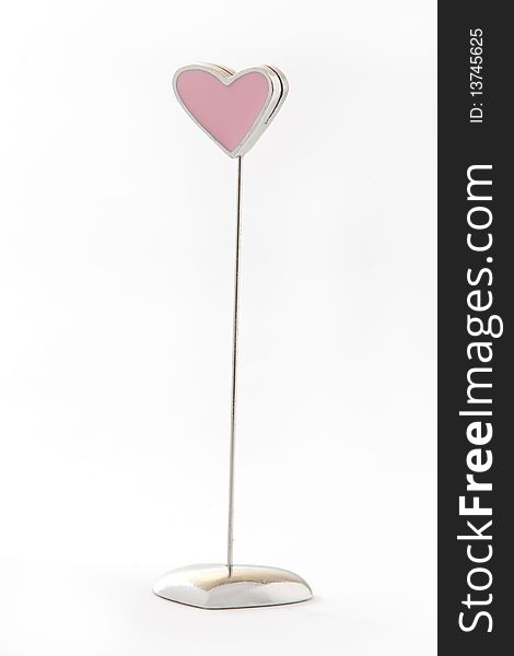 A pink heart shape notes holder