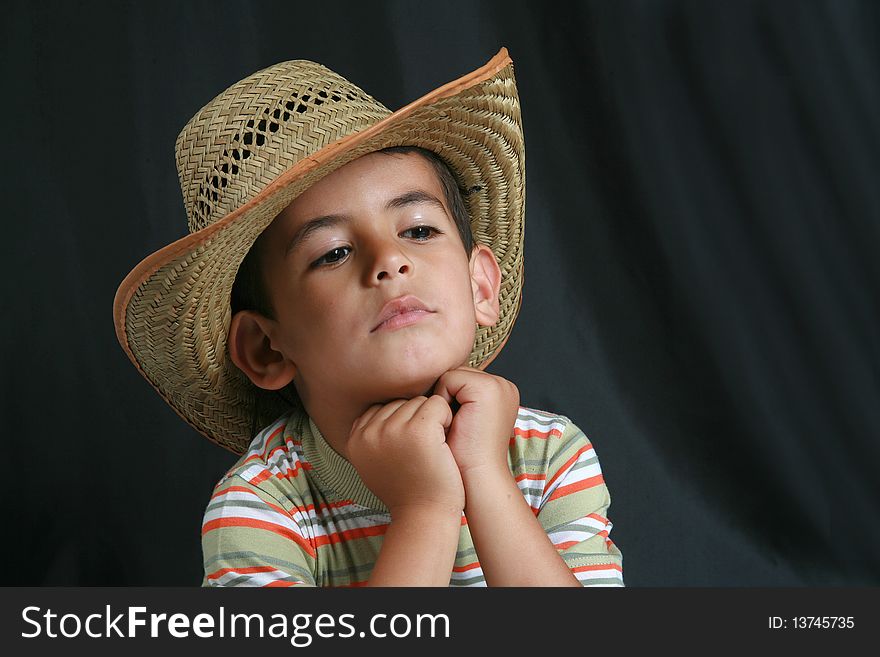 At the beginning of a young boy with cowboy hat image. At the beginning of a young boy with cowboy hat image