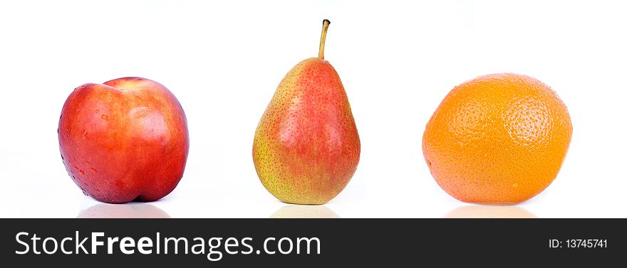 Closed-up peach, pear and orange isolated on white