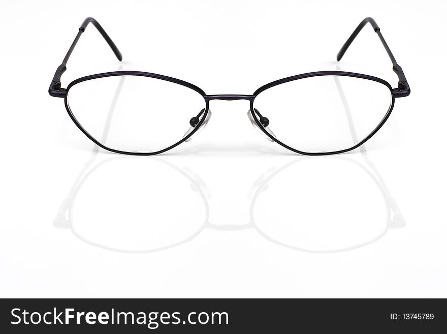 Eyeglasses closeup on a white background with reflection