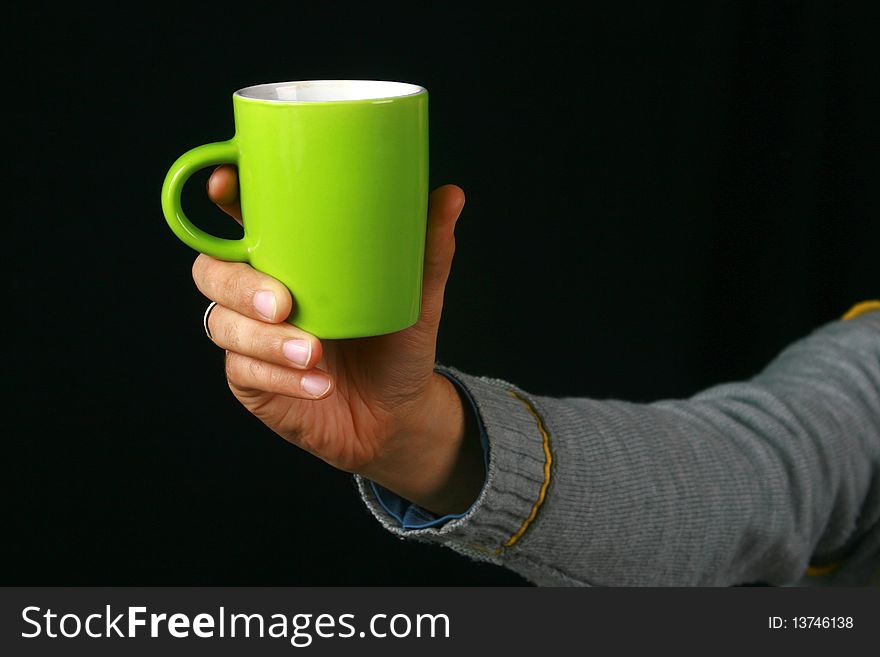 An image of a charismatic man drinking tea. An image of a charismatic man drinking tea