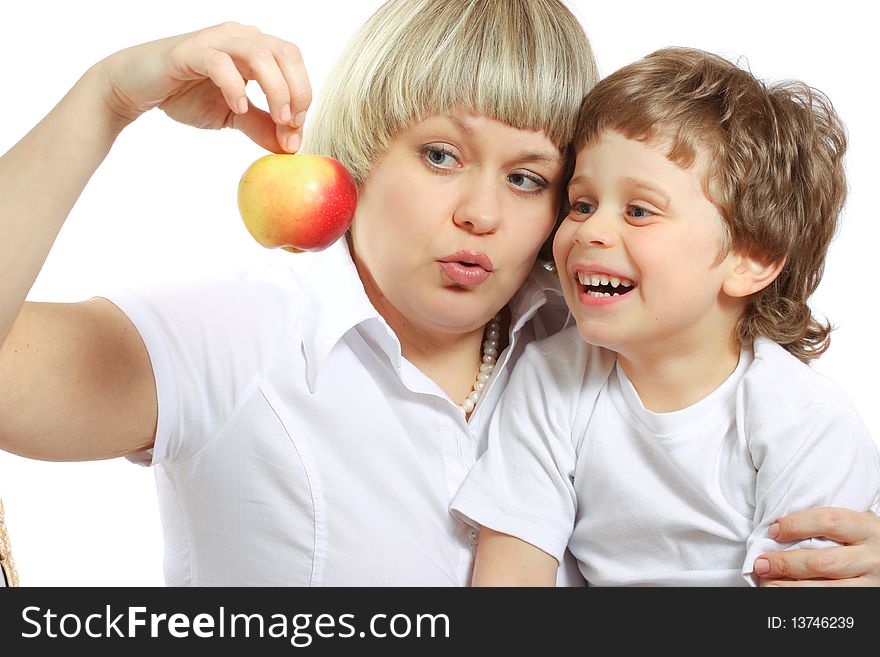 Woman and boy eating apple