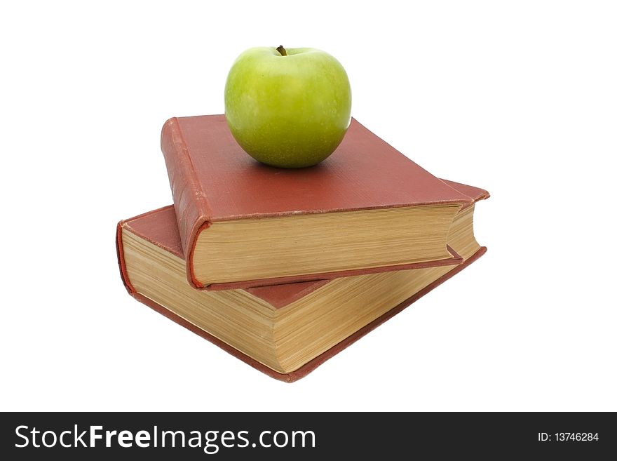 Books and green apple