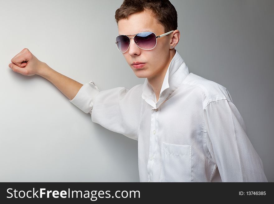 Portrait of young handsome man in sunglasses