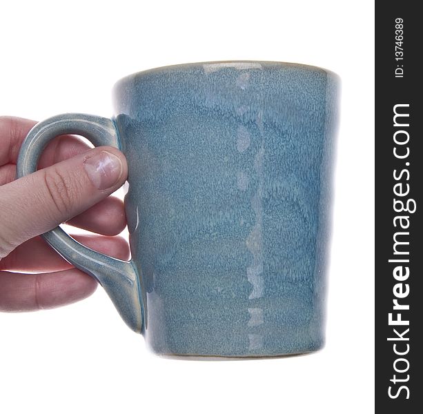 Coffee Mug Cup in a Hand.  Isolated on white with a clipping path. Coffee Mug Cup in a Hand.  Isolated on white with a clipping path.