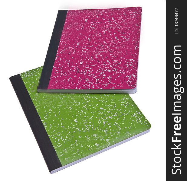 Vibrant Notebooks in pink and green isolated on white.