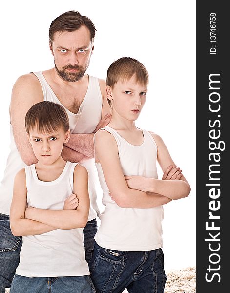 Young father with his two sons standing on a white