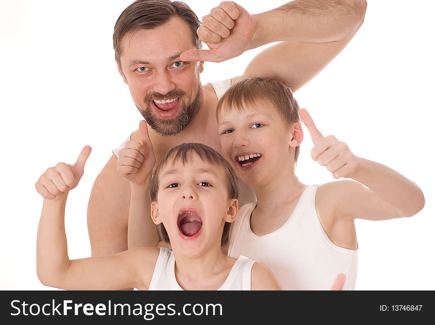 Young father with his two sons standing on a white background