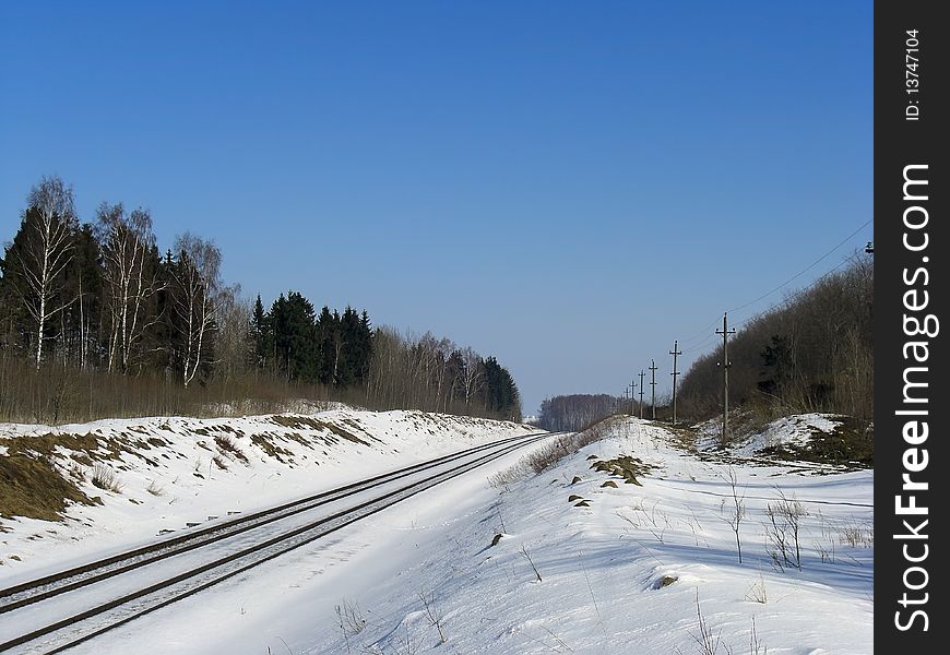 Landscape with a railroad at winter