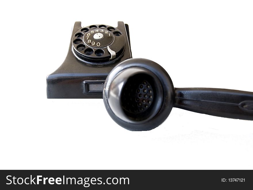 Black retro telephone on white