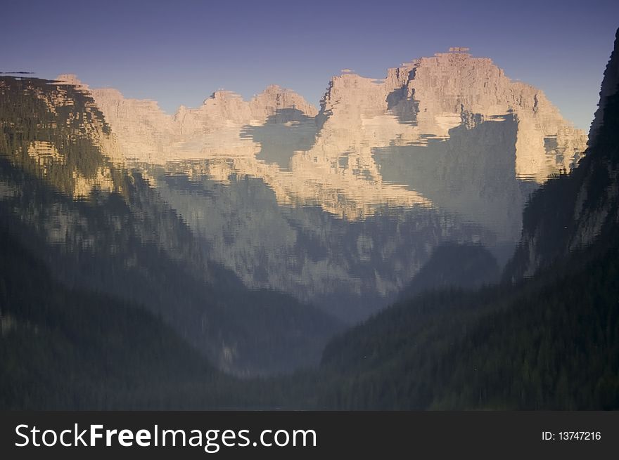 Lake water reflection of limestone peak in austrian alps gosau. Lake water reflection of limestone peak in austrian alps gosau