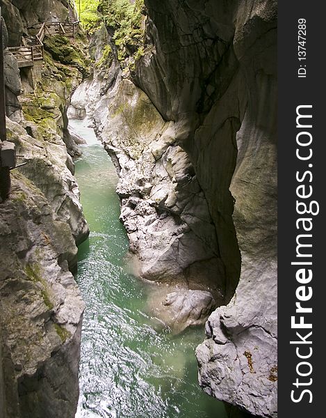 Limestone gorge in alps mountains  flowing river water reflection. Limestone gorge in alps mountains  flowing river water reflection