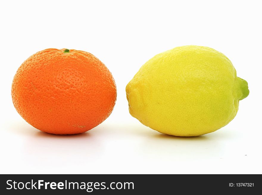 Delicious lemon and orange  fruits on a white background