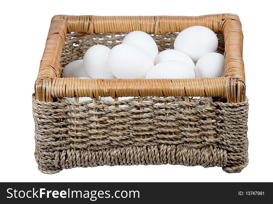 Basket with eggs it is isolated on a white background