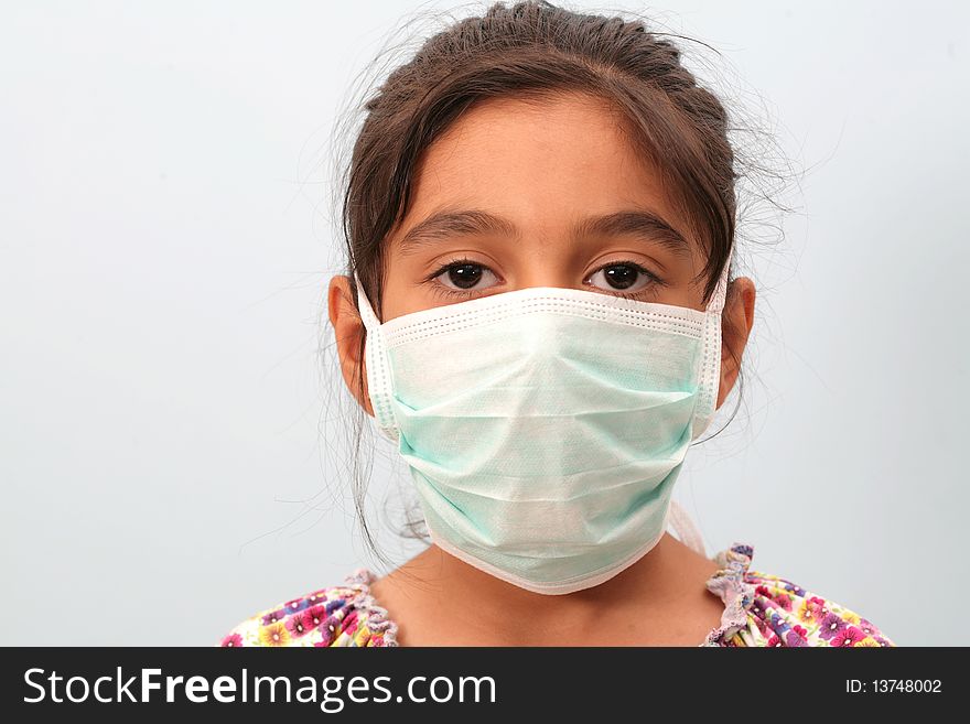 To protect from disease, a small girl wearing a mask. To protect from disease, a small girl wearing a mask