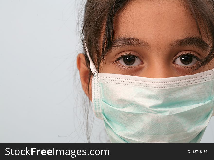 To protect from disease, a small girl wearing a mask. To protect from disease, a small girl wearing a mask