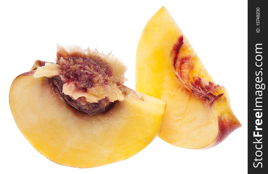 Sliced Nectarine with pit isolated on white with a clipping path.