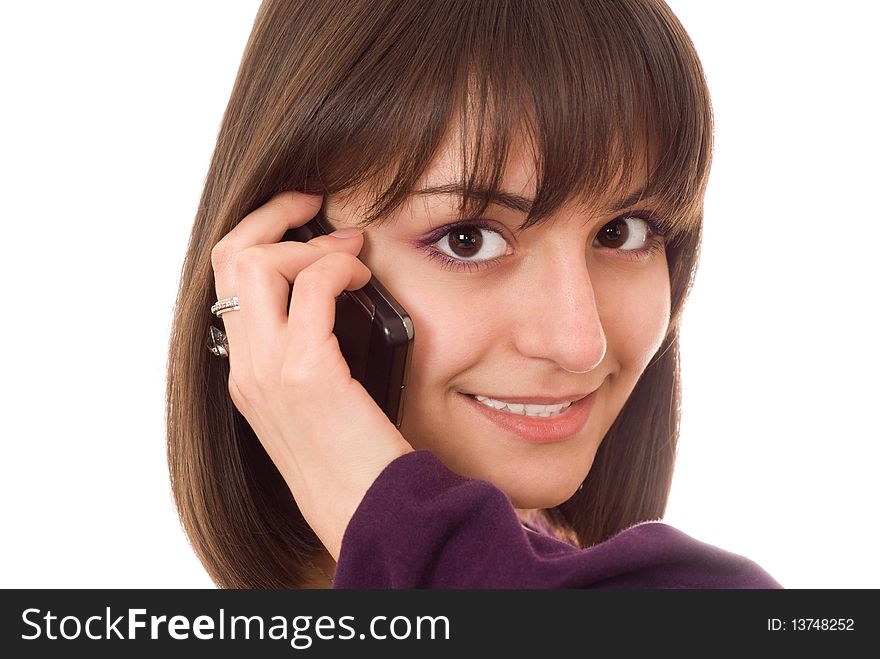 Young pretty girl with a phone on a white background