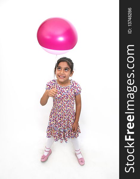 The joy of a little girl playing with balloons. The joy of a little girl playing with balloons