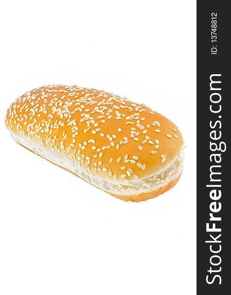 Appetizing bun with sesame isolated on white