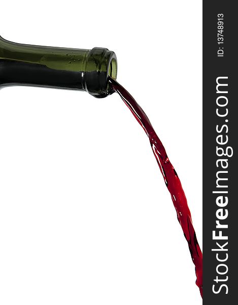 Red wine pouring out of bottle
