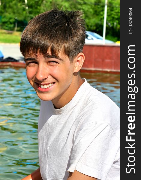 Smiling teenager portrait near the water