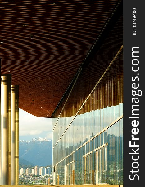 Glass wall of the Convention Center, Vancouver, BC. North Vancouver in the distance.