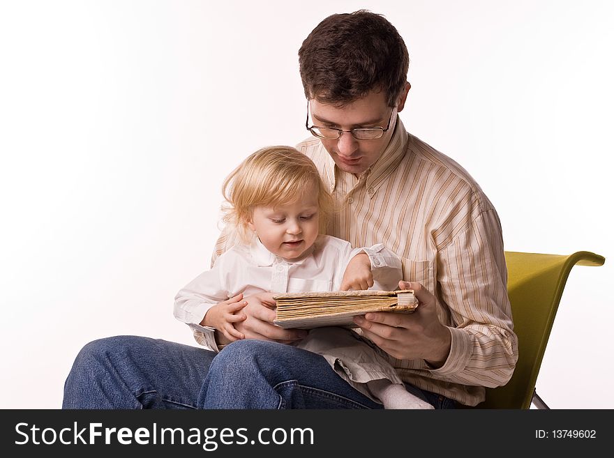 Man and child with book on white